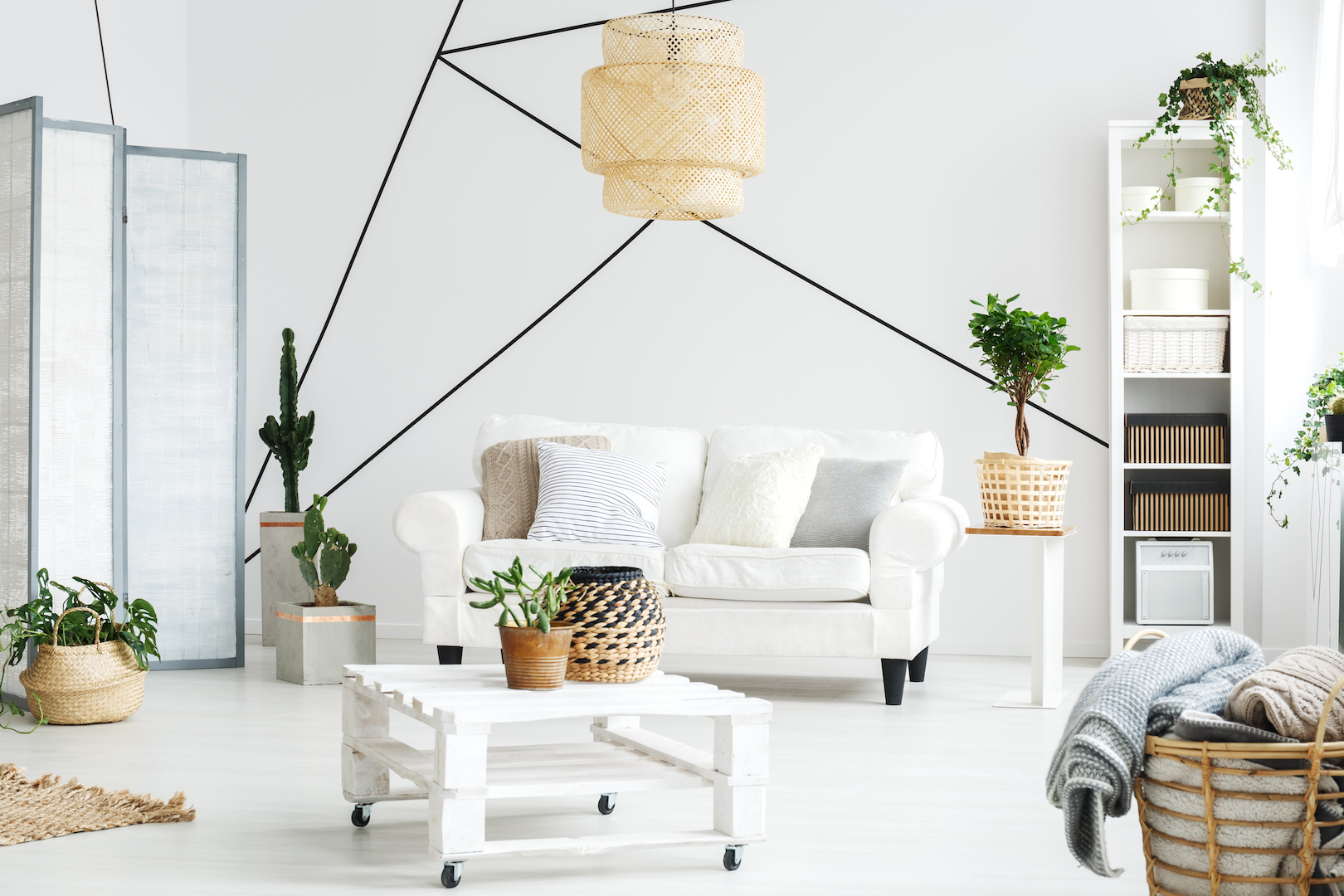 Wooden  white coffee table and comfortable sofa in lounge